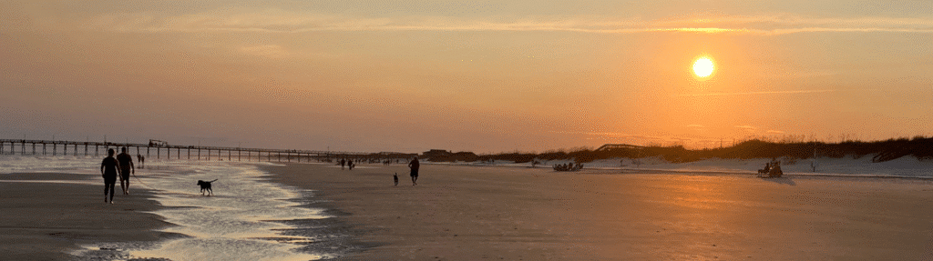 sunset at beach Graceful Greens Getaways