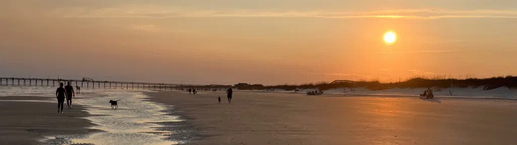 sunset at beach Graceful Greens Getaways